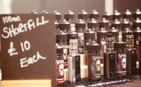 a table topped with lots of bottles of liquid